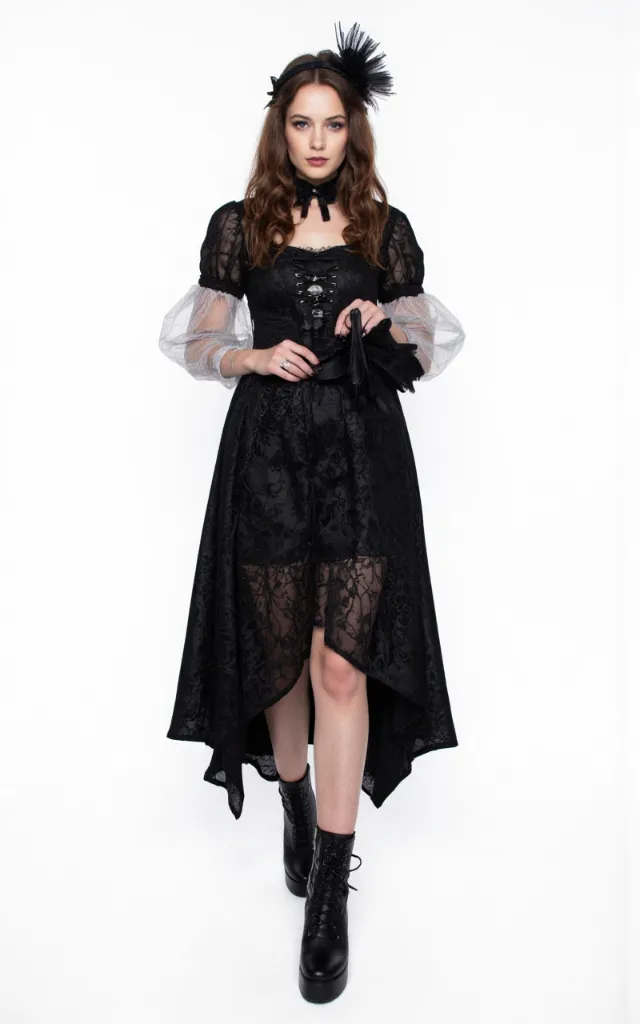 A French female model wearing Gothic   style clothing, against a white background, in a front   facing shot focusing on shoes